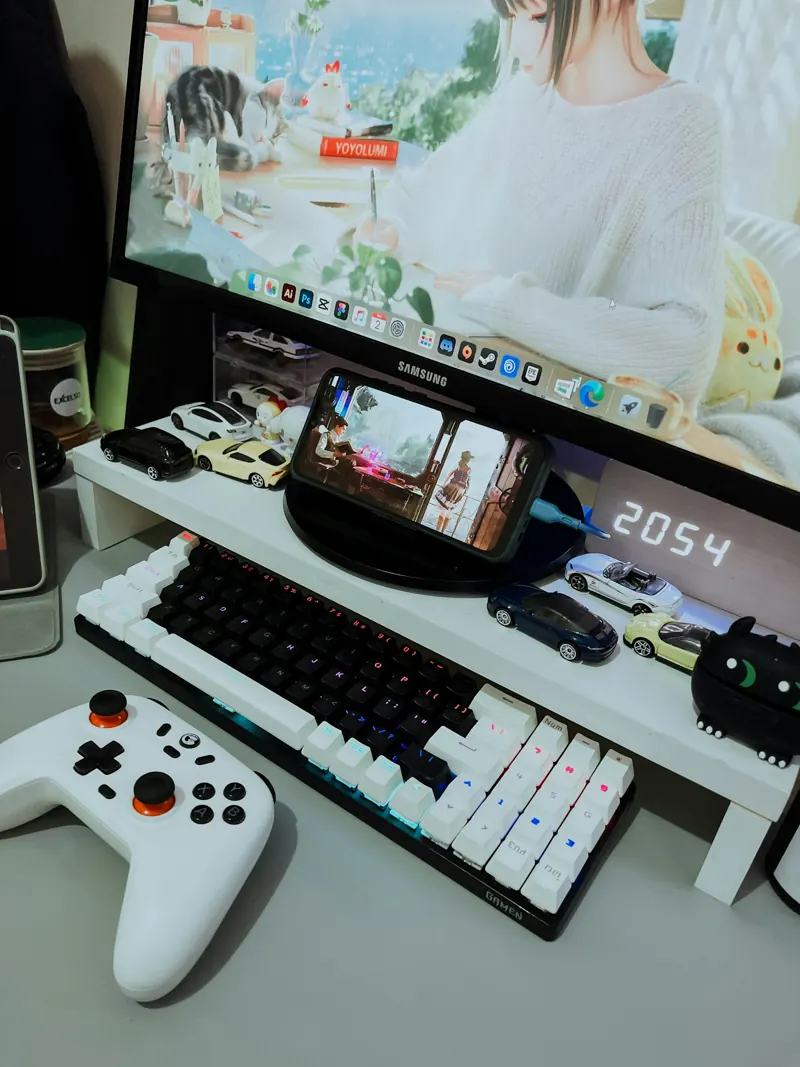 Game development desk with code and production tools.